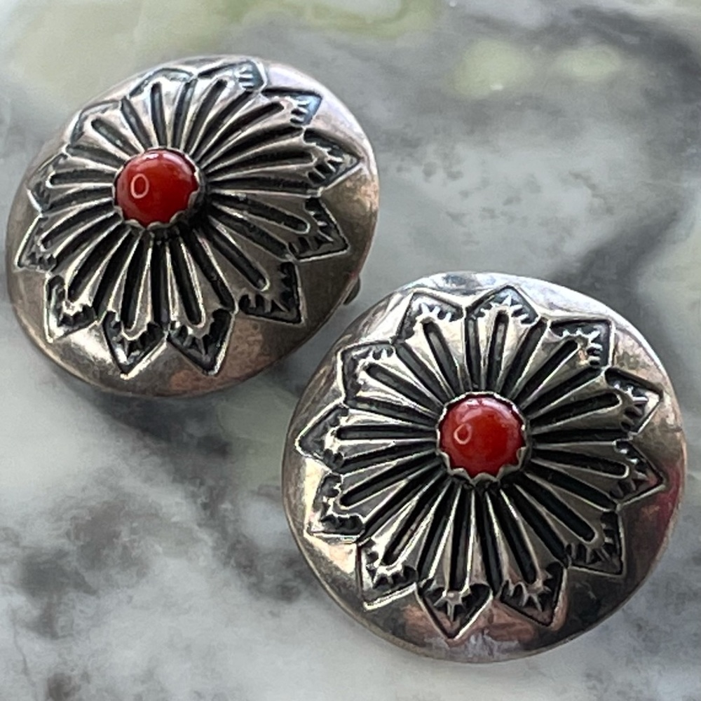 Sterling silver & coral Southwest concho earrings.